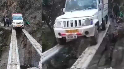 mahindra bolero pik up balances on pipes to cross deep gap video viral